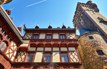Tower and facade with old windows of Wernigerode Castle. Germany