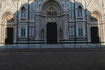 Battistero's shadow on Duomo's doors