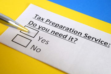 Obraz premium One person is answering question about tax prepration service.