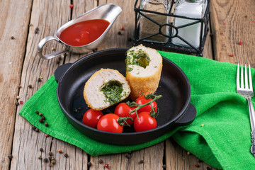 chicken Kiev with tomatoes on a plate