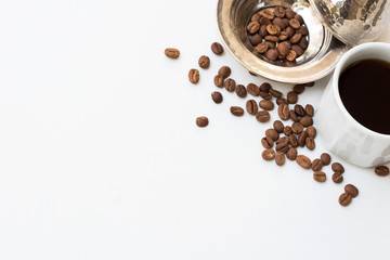 Coffee beans, traditional bowl and coffee mug on white background. Coffee background