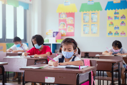 Childen Students Wearing Cloth Masks To Prevent The Outbreak Of Covid 19 In The Coronavirus Classroom, Outbreak Of Contagious Disease In The Respiratory,education.