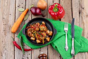 chicken briskaet fried on pan with vegetables