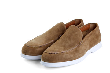 Men's elegant beige suede shoes on white rubber sole. Top view at an angle.
