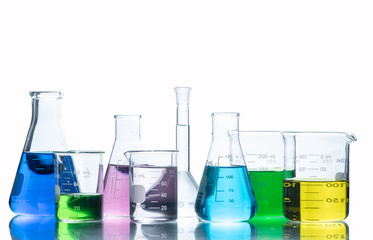 Laboratory glassware with liquids of different colors,