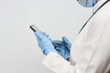 Female doctor using mobile phone during the break