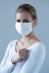 Portrait of young and natural woman in medcial mask. Pandemic, coronavirus, covid-19 and protection concept.