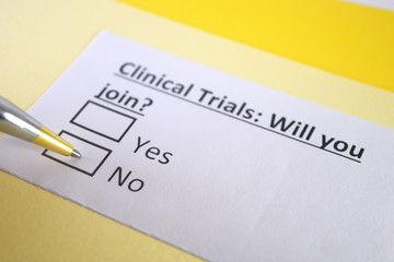 Obraz premium One person is answering question about clinical trials.