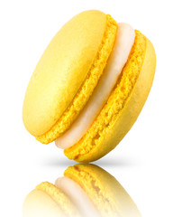 Macro photo of french yellow macaroon isolated on white background