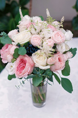 Wedding flowers, bridal bouquet closeup. Decoration made of roses, peonies and decorative plants, selective focus, nobody, objects