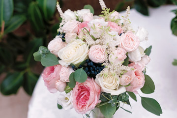 Wedding flowers, bridal bouquet closeup. Decoration made of roses, peonies and decorative plants, selective focus, nobody, objects