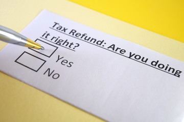 Fototapeta premium One person is answering question about tax refund.