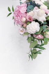 Original wedding floristics closeup. The wedding flower bouquet is supplemented with rose hortensia, roses and greenery. Floral background. Greeting card template. Mother day