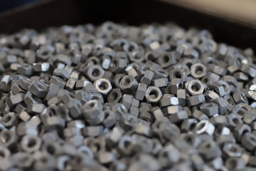 the raw material of the screw and machine producing bolts at the factory 