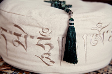 Mala on meditation cushion