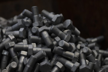 the raw material of the screw and machine producing bolts at the factory 