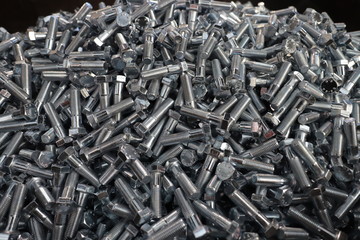 the raw material of the screw and machine producing bolts at the factory 