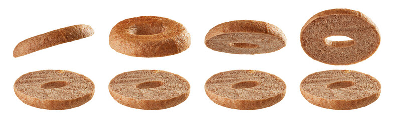 Halved bagels flying on white background