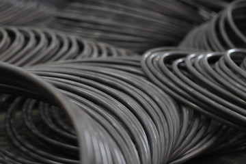the raw material of the screw and machine producing bolts at the factory 
