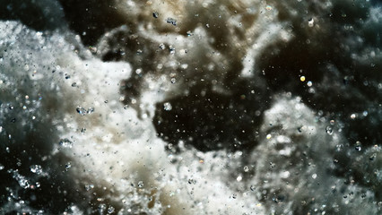 Water backgrounds with foam spray fast flow.