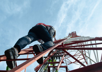 engineer climb high tower to maintenance working,safety work with PPE,telecom tower for 5G network