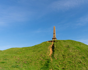 War memorial on top of Ham Hill in Somerset countryside in the United Kingdom.  Bright blue skies on a clear and sunny day in England