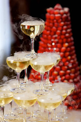Crystal glasses for holiday, a lot of glasses for guests. Slide pyramid of glasses.
