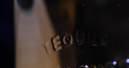 Tequila Bottle with Inscription Rotating 