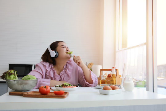 Plus size, Fat woman enjoy eating in ketchen