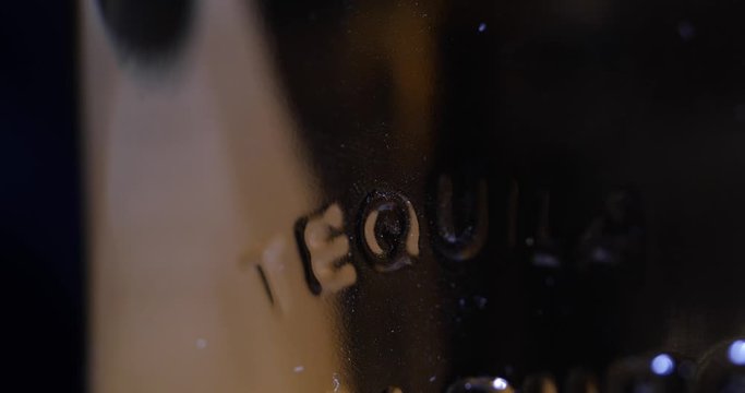 Tequila Bottle with Inscription Rotating 