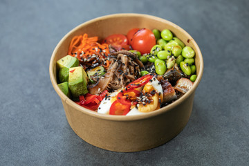 Traditional Hawaiian poke salmon dish in a cardboard box
