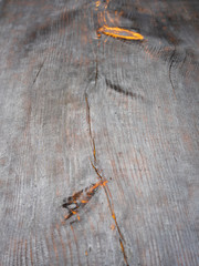 black board with knots. Background of black burnt board