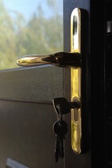 Key in a door lock close up