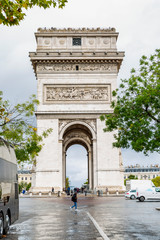 Fototapeta na wymiar Paris, France, 10/09/2019: View of the Arc de Triomphe. Walking tourists. Vertical.