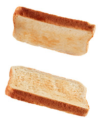 Slices of toasted bread flying isolated on white