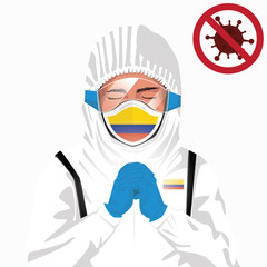 Covid-19 or Coronavirus concept. Colombian medical staff wearing mask in protective clothing and praying for against Covid-19 virus outbreak in Colombia. Colombian man and Colombia flag. Pandemic