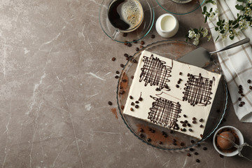 Fototapeta na wymiar Composition with tiramisu on brown background, top view. Sweet dessert