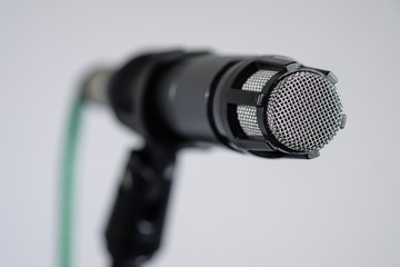 Dynamic vocal or instrument microphone on stand close-up