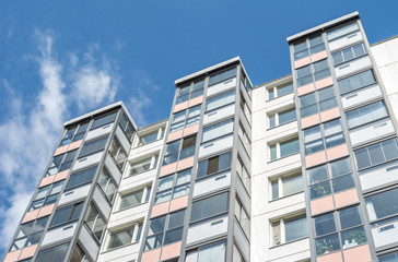 Fototapeta na wymiar Modern Giant Apartment Building Blue Sky Facade Home Residential Structure