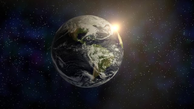 Earth seen from space with timelapse clouds and rising sun