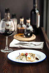 Chicken fillet rice sauce with a glass of red wine