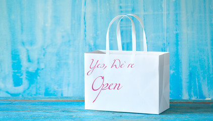 Reopening shopping centers after the coronavirus lockdown,shopping bag with open sign, symbol, good...