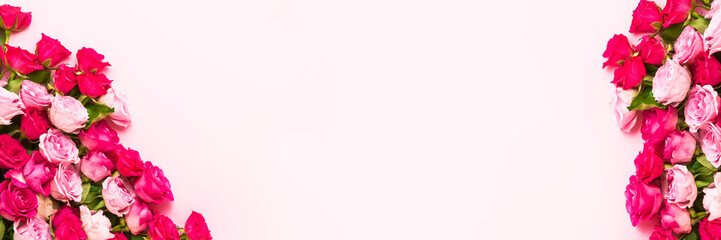 Fototapeta premium Pink Holiday banner. Bouquet of pink and red roses on pink background. Mother's day, Valentines Day, Birthday celebration concept. Copy space, top view