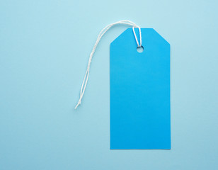 empty blue paper tag tied with white string