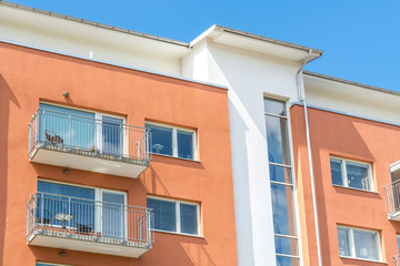 Fototapeta na wymiar Modern Luxury Apartment Building Blue Sky Facade Home Residential Structure