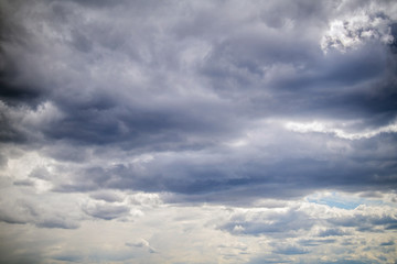 Fototapeta na wymiar Gloomy dark clouds floating in the sky