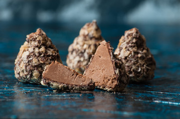 Tasty chocolates wafer crumbs sliced into slices, half and general closeup side view and top