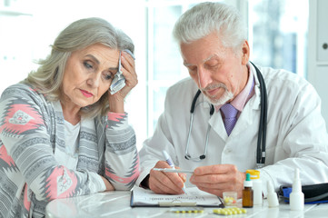 Close-up portrait of senior doctor with elderly patient