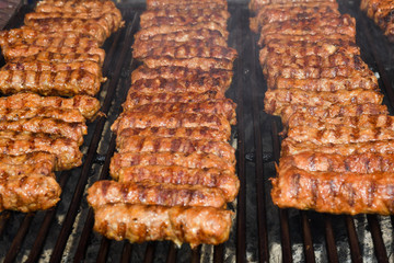 Chef grilling meat during cookout picnic or food event. Meat mix variety, Labour Day, 1 Mai