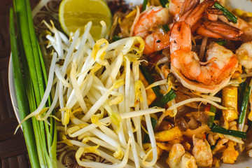 Thai Stir-fried rice noodles (Pad Thai) with shrimp and vegetables. One of the most famous food in Thailand. Thailand traditional dish.